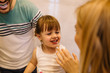 © Nebojsa - Happy family having fun while they are brushing their teeth in bathroom