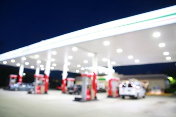 Gas Station at Night with Cars at Pumps Abstract Out of Focus