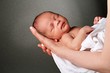 © herlanzer - baby in mothers arms stock photo