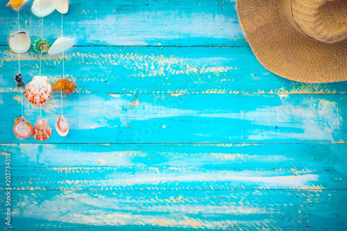 Stampa su Tela Beach background - starfish, shells, coral on wood table in blue sea color background
