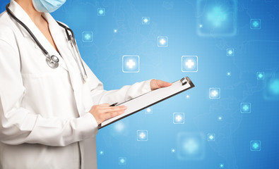 Female doctor holding notepad with blue background and crosses