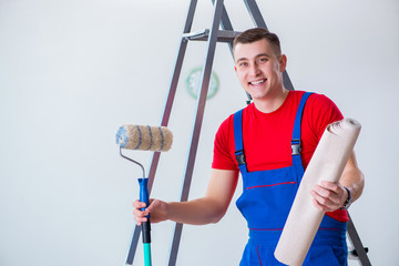 Wall Mural - Contractor worker preparing for wallpaper decoration