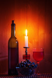 Fototapeta  - Still life with a burning candle. The photo was taken in a personal photographer's studio