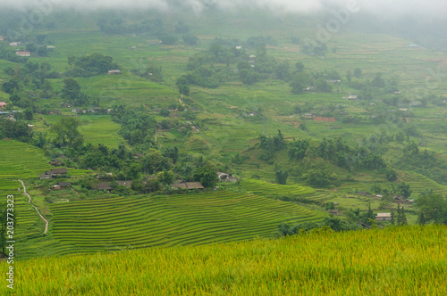 Foto Picturesque view on high mountain village among rice terraces