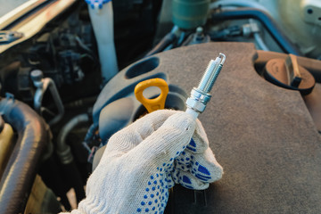 Wall Mural - replacing spark plugs in the car