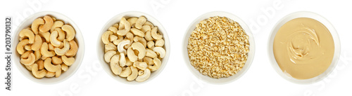 Cashew nuts in white porcelain bowls Fotobehang