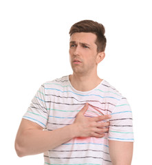 Wall Mural - Young man having heart attack on white background