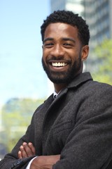 Canvas Print - Beautiful happy businessman outside