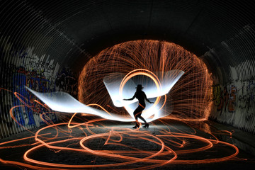 unique creative light painting with fire and tube lighting