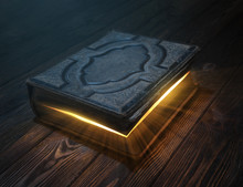 Old Magic Book On Wooden Table With Light Rays Coming Out Form Inside