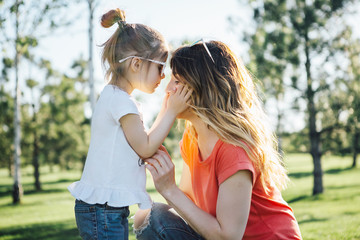 mother hugs her dauhter.
