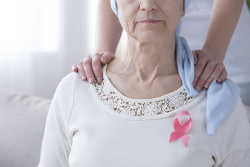 Wall Mural - Pink ribbon on sick woman