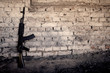 submachine gun kalashnikov AK-47 against the wall