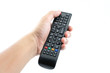 © pakphoto - Hand pressing power button on TV remote control