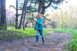 © mihakonceptcorn - Little girl runing along the forest path, a bright photo of spring.