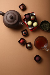 Wall Mural - Brown tea and chocolate candies background