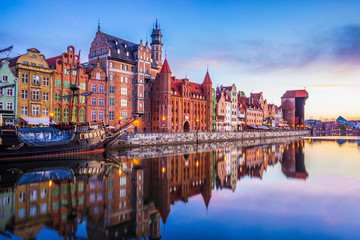 Amazing sunrise. Old town of Gdansk at Motlawa river, Poland