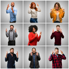 Wall Mural - Group of mixed people, women and men with crossed fingers asking for good luck