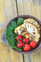 Canvas Print - Baked cauliflower with tomatoes and spinach