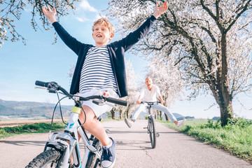 Wall Mural - Family active leisure - father and son have a fun when they ride a bicycles