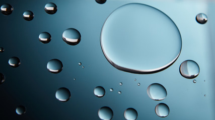 Wall Mural - water drops background with big and small drops