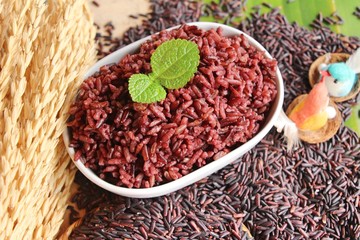 Wall Mural - cooked black rice and raw organic riceberry rice