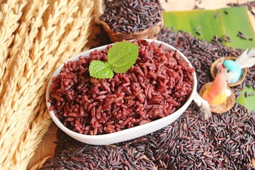 Wall Mural - cooked black rice and raw organic riceberry rice