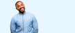 © Krakenimages.com - African american man with beard confident and happy with a big natural smile laughing isolated over blue background
