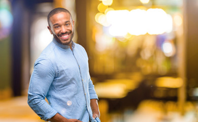 Sticker - African american man with beard confident and happy with a big natural smile laughing at night