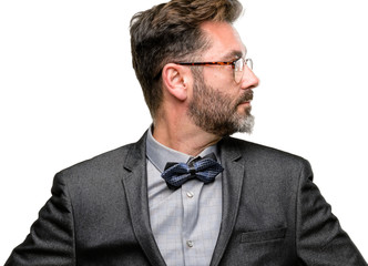 Poster - Middle age man, with beard and bow tie side view portrait isolated over white background