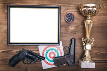Best Shooter Diploma. First Place Winner In Shooting. Professional Shooter Certificate Mock Up. Gun, Gold Medal And Blank Photo Frame.