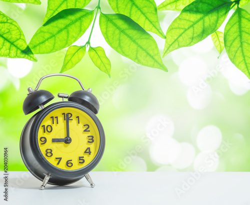 Closeup Alarm Clock Show The Time In 9 O Clock On White Desk On Blurred Leaves In Garden View In The Morning Textured Background Stock Photo Adobe Stock