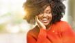 © Krakenimages.com - Beautiful african woman happy and surprised cheering expressing wow gesture, outdoor
