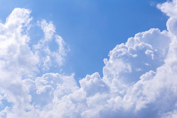 Blue sky background with white clouds, rain clouds on sunny summer or spring day.