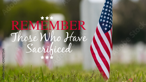 Fotomural Small American flags and headstones at National cemetary- Memorial Day display -