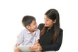 © wckiw - Mother and son playing tablet learn together with happy face