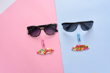 Wall Mural - sunglasses / eyewear on pastel color paper background 