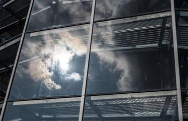 Wall Mural - The glass architecture in city against a sky