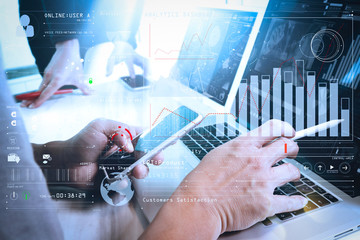 Poster - Photo website graphic designer hand working with his team make new project in studio.Modern laptop extend screen digital tablet smart phone on wood table. sun flare effect