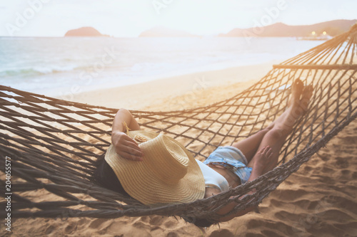 Fotografía Happy woman relaxing in hammock