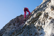Girl climber climber climbs the rock. Climbing. Extreme sport