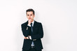 © GolubaPhoto - Portrait of young business man \ stock-market broker wondering\thinking over solving a probem, copy space, white background