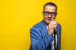 © F8  \ Suport Ukraine - Portrait of mature man singing on yellow background