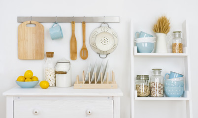 Kitchen wall decorated interior with cabinet and shelf with utensils