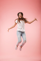 Sticker - Full length of an excited young woman jumping