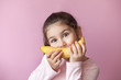 © kaganskaya115 - Little girl with yellow banana like smile