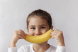 © kaganskaya115 - Little girl with yellow banana like smile