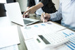 © Puwasit Inyavileart - Investors are checking the company's financial statements. The secretary has prepared the information.