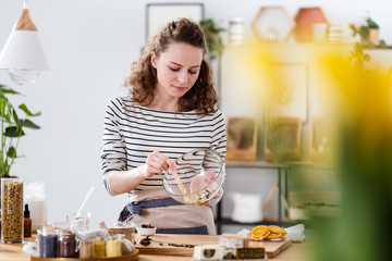 Vegan woman mixing natural ingredients