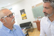 © auremar - senior patient with ophthalmologist in eye clinic